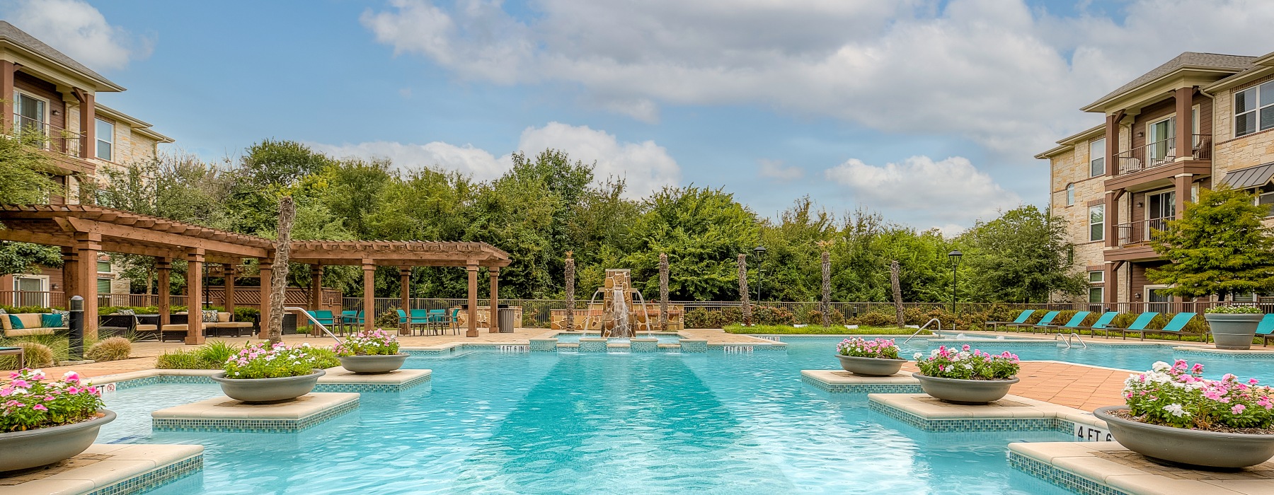 Sparkling Pool on a sunny day with flower pots